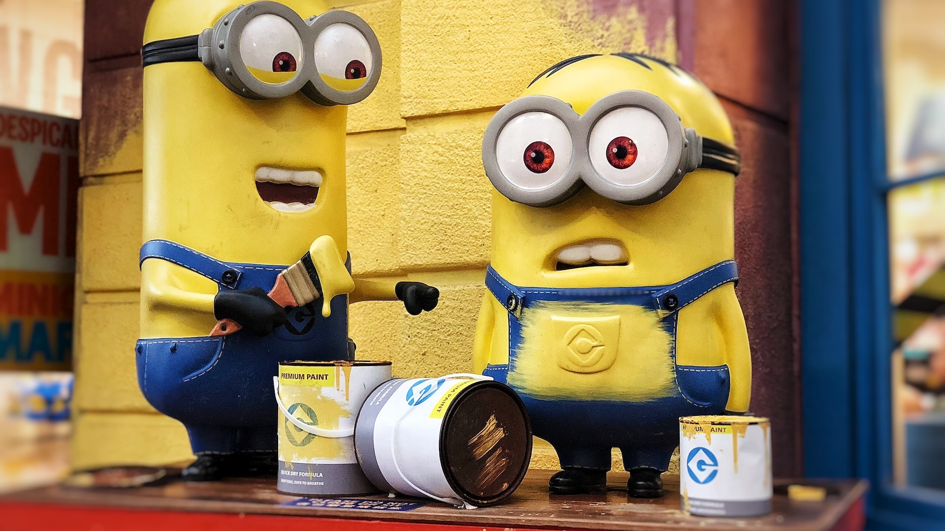 two Minions character figure on red table